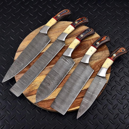 Hand forged 5 pieces Damascus steel chef knife set with leather sheath displayed on rustic timber.