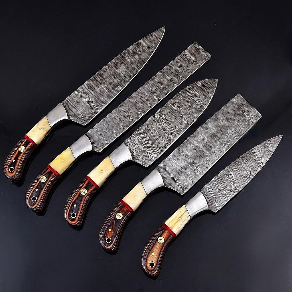 Macro detail of 512 layer hand forged Damascus steel blade with signature twist pattern.