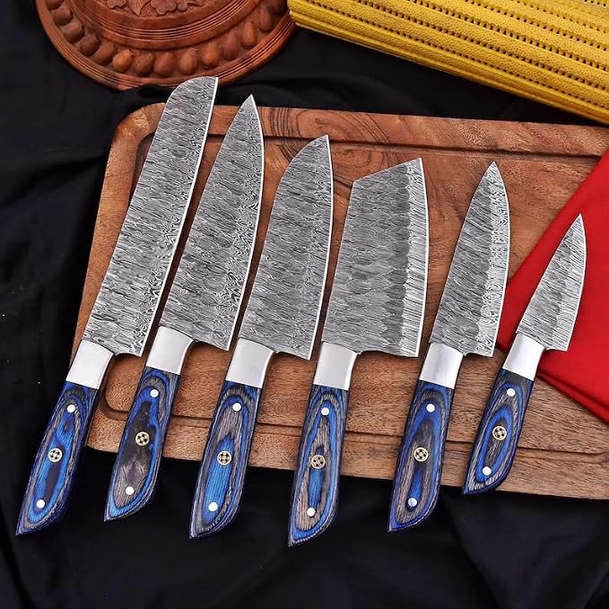 Close up of 6 Damascus knives with pakka wood handles and mosaic pins