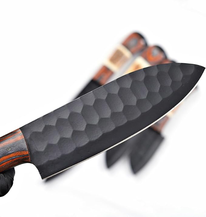 Close up of black blade tip with wood handle