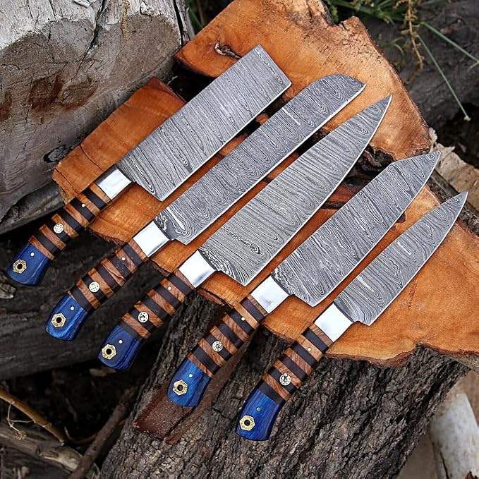 5 piece Damascus knife set with pakka wood handles on rustic wood
