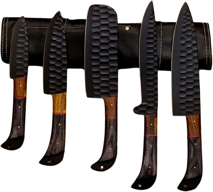 Overhead view of five black kitchen knives sized from small utility up to chef knife