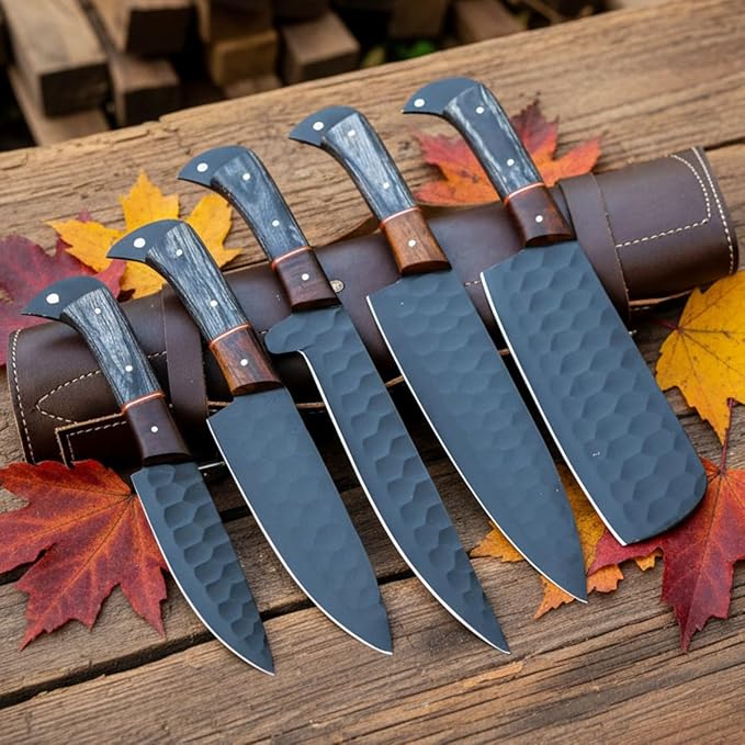 5 piece knife set with black blades on autumn leaves