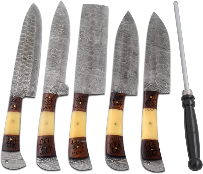Close up of hammered Damascus steel blades with carved wood handles and a sharpening rod