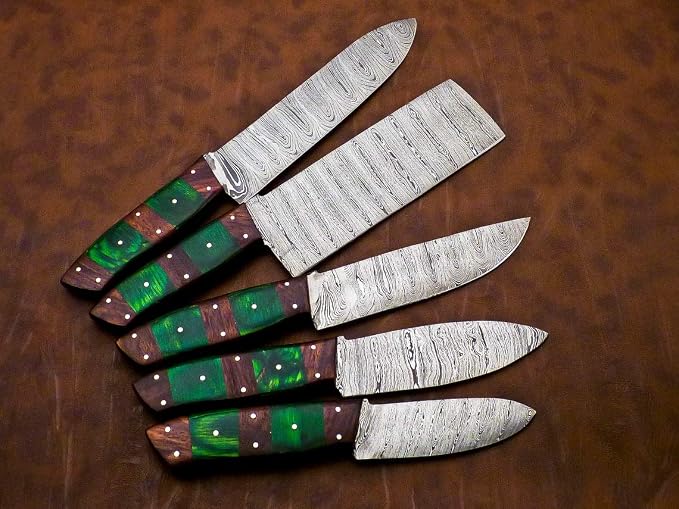 Close up of Damascus steel blades with green and red striped handles and white pins