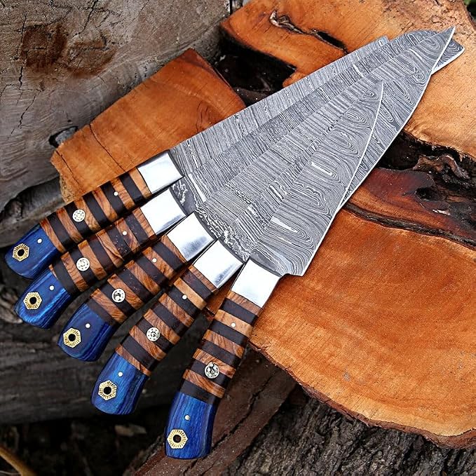 Close up of Damascus knives with pakka wood handles and blue accent