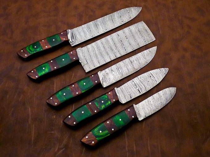 Damascus steel knife set with striped green and red handles arranged in a row