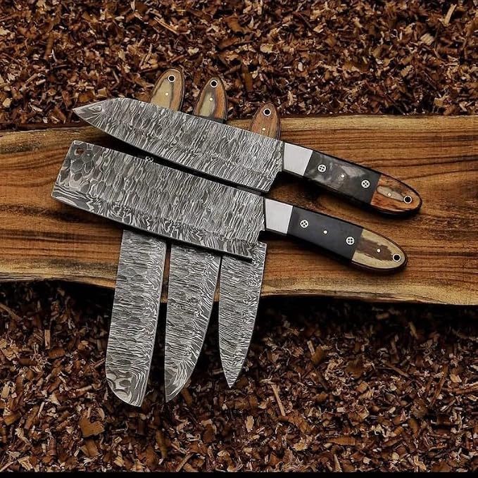 Close up of 3 Damascus knife blades with pakka wood handles
