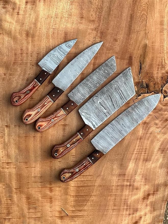 5 pieces Damascus knives with wood handles fanned on wood board