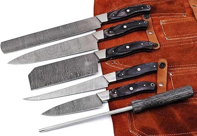 5 Pieces Damascus Steel Chef Knife Set fanned out with pakka wood handles on a rust leather roll