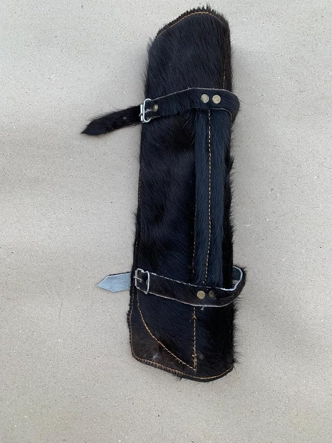 Closed black fur leather roll case with buckle straps