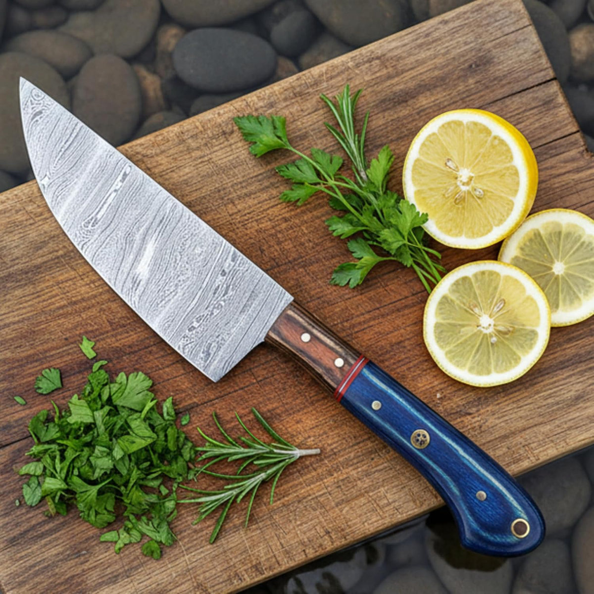 Damascus chef knife on a wooden board with lemon slices, parsley and rosemary