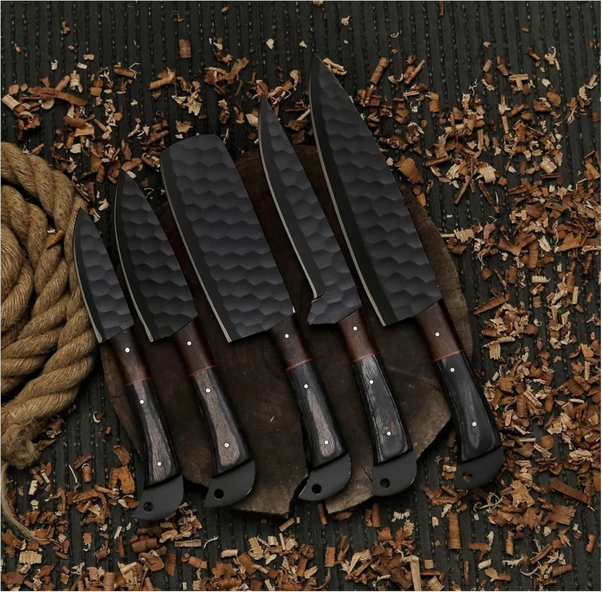 Five black honeycomb hammered kitchen knives lined up with two tone wood handles