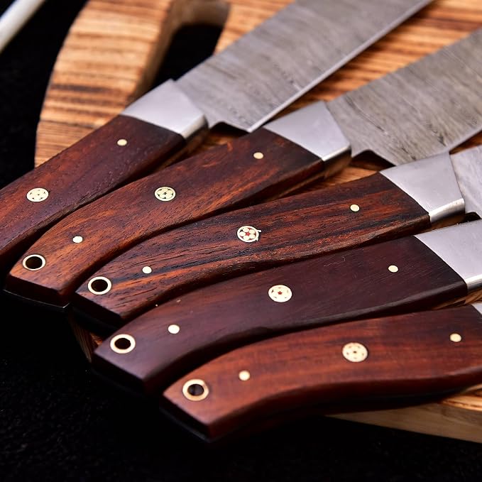 Close up of the rosewood handles with brass mosaic pins on the 5 Pieces Damascus Knife Set