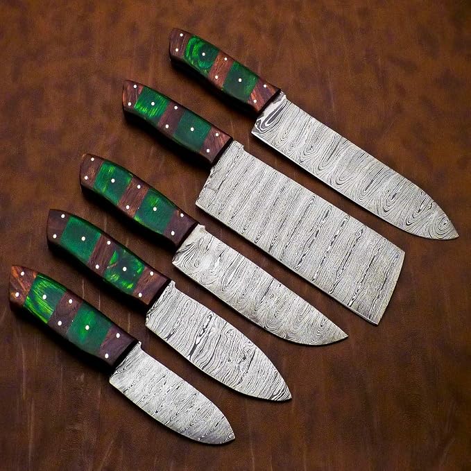 Damascus steel knife set with green and red striped handles fanned on a wood surface