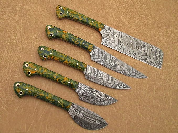 5 piece Damascus steel knife set with mottled acrylic handles fanned diagonally on tan leather background