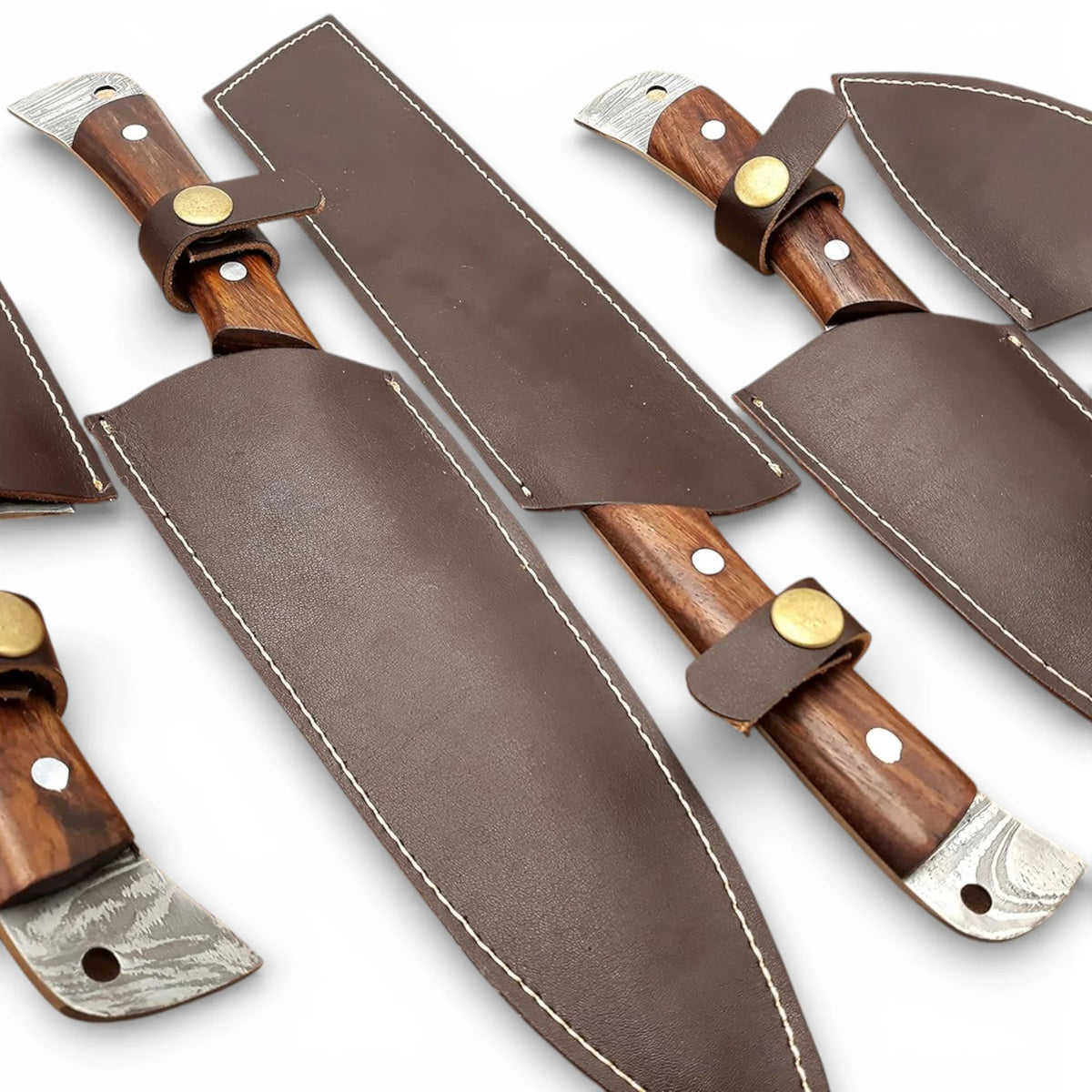 Professional culinary chef knives with pakka wood handles placed neatly inside custom leather sheaths