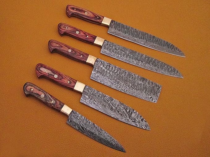 5 Damascus knives with pakka wood handles fanned diagonally