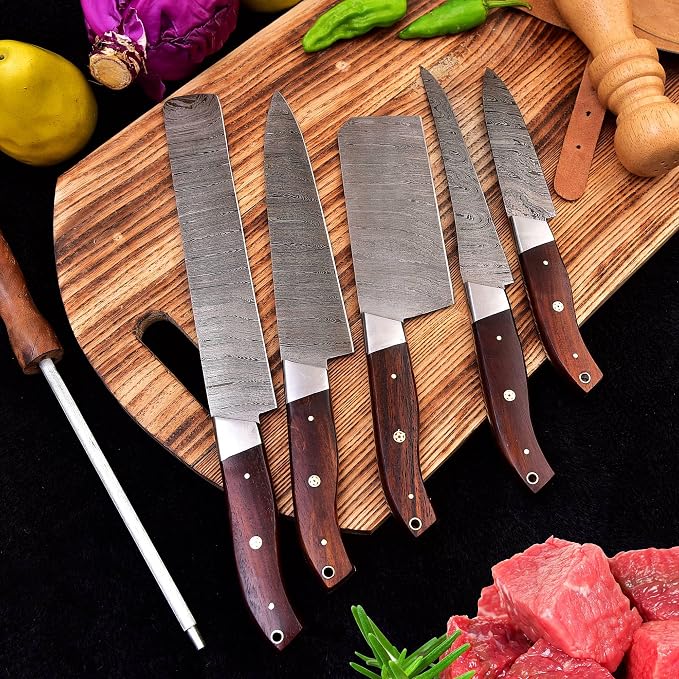 5 Pieces Damascus Steel Chef Knife Set fanned out beside fresh cuts of raw meat