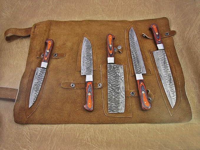 Damascus blades exposed beside sheaths in open leather case