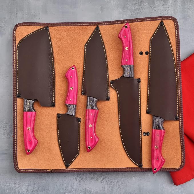 5 piece knife set with pink handles on wood board