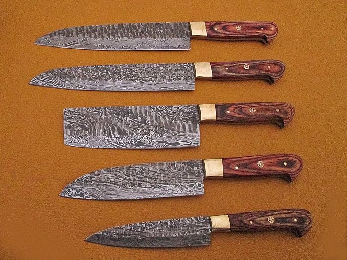 5 Damascus knives with pakka wood handles arranged by size