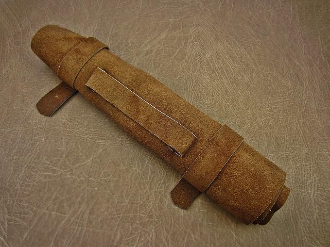 Closed tan suede knife roll case with buckle straps