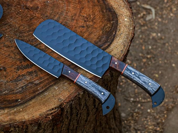 Close up of two black blade knives on wood stump