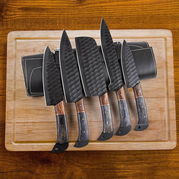 5 piece Damascus steel knife set with wood handles arranged on a wood cutting board