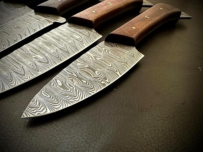 Close up of Damascus steel blades and wood handles overlapping