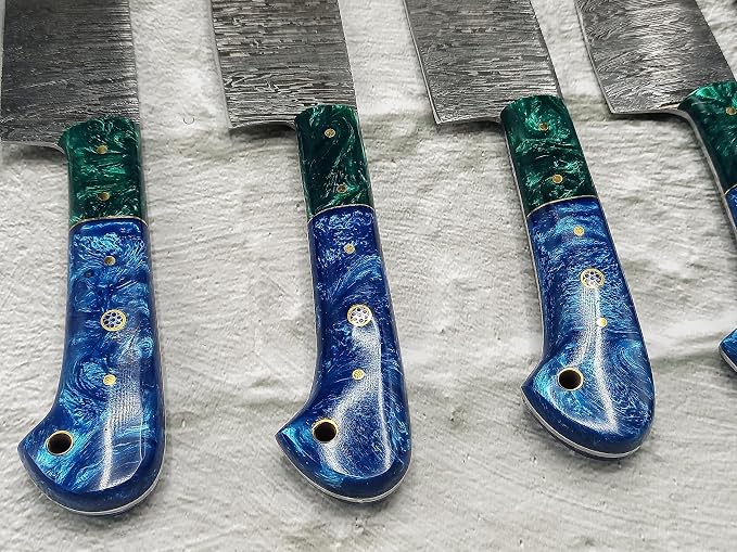 Close up of green and blue knife handles side by side