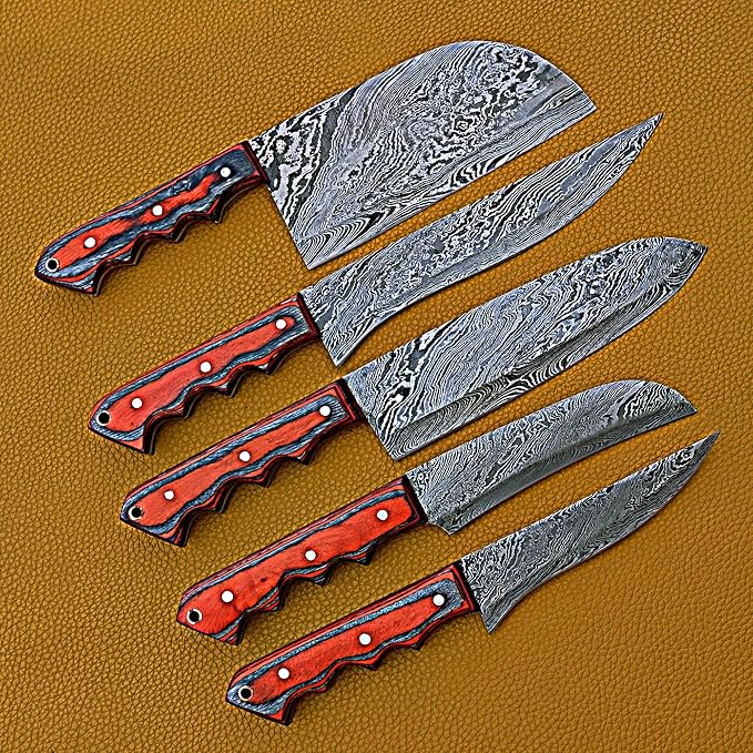 5 Damascus knives with black trimmed handles crossed