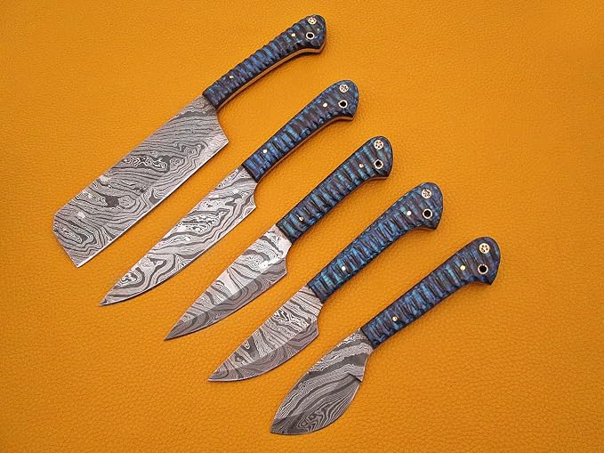 5 piece Damascus steel knife set fanned out with blue and grey acrylic handles facing up on orange background
