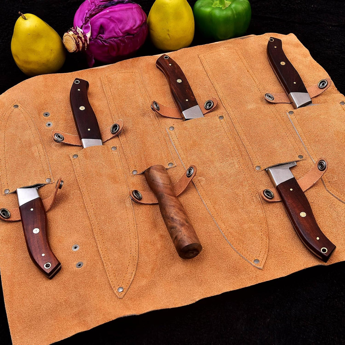 Leather roll case opened to show all 5 Damascus steel knives and the rod in their slots