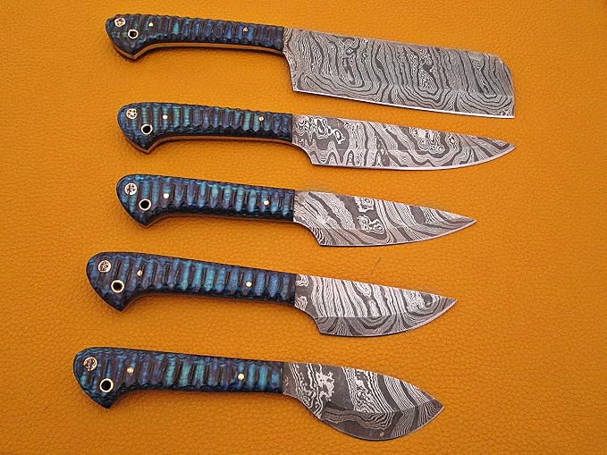 5 piece Damascus steel knife set with blue and grey acrylic handles lined up by size on orange background