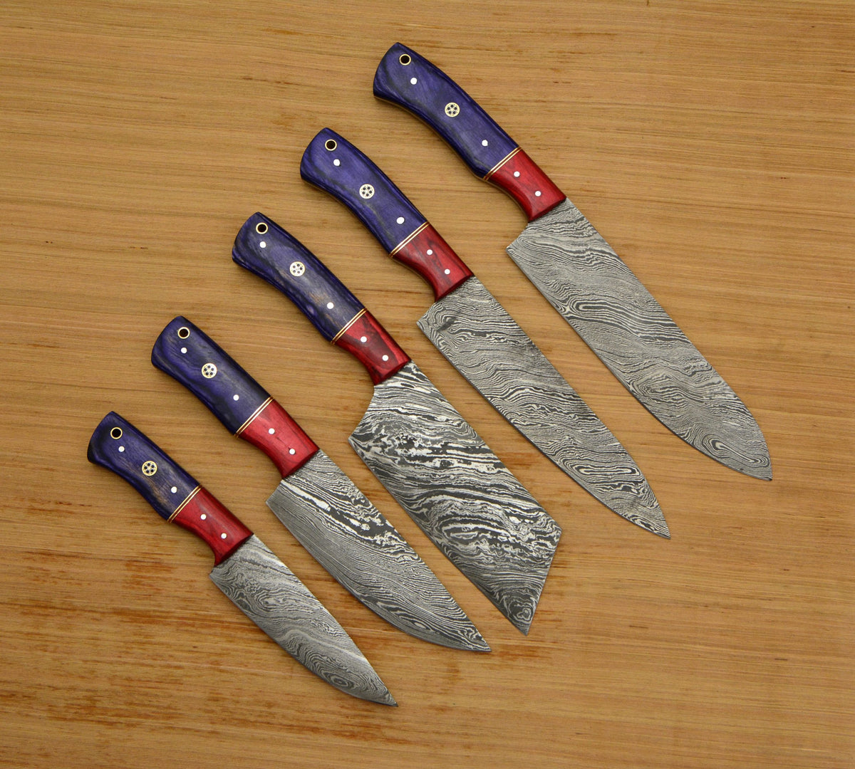 Damascus knife set of five in a row from utility knife up to chef knife