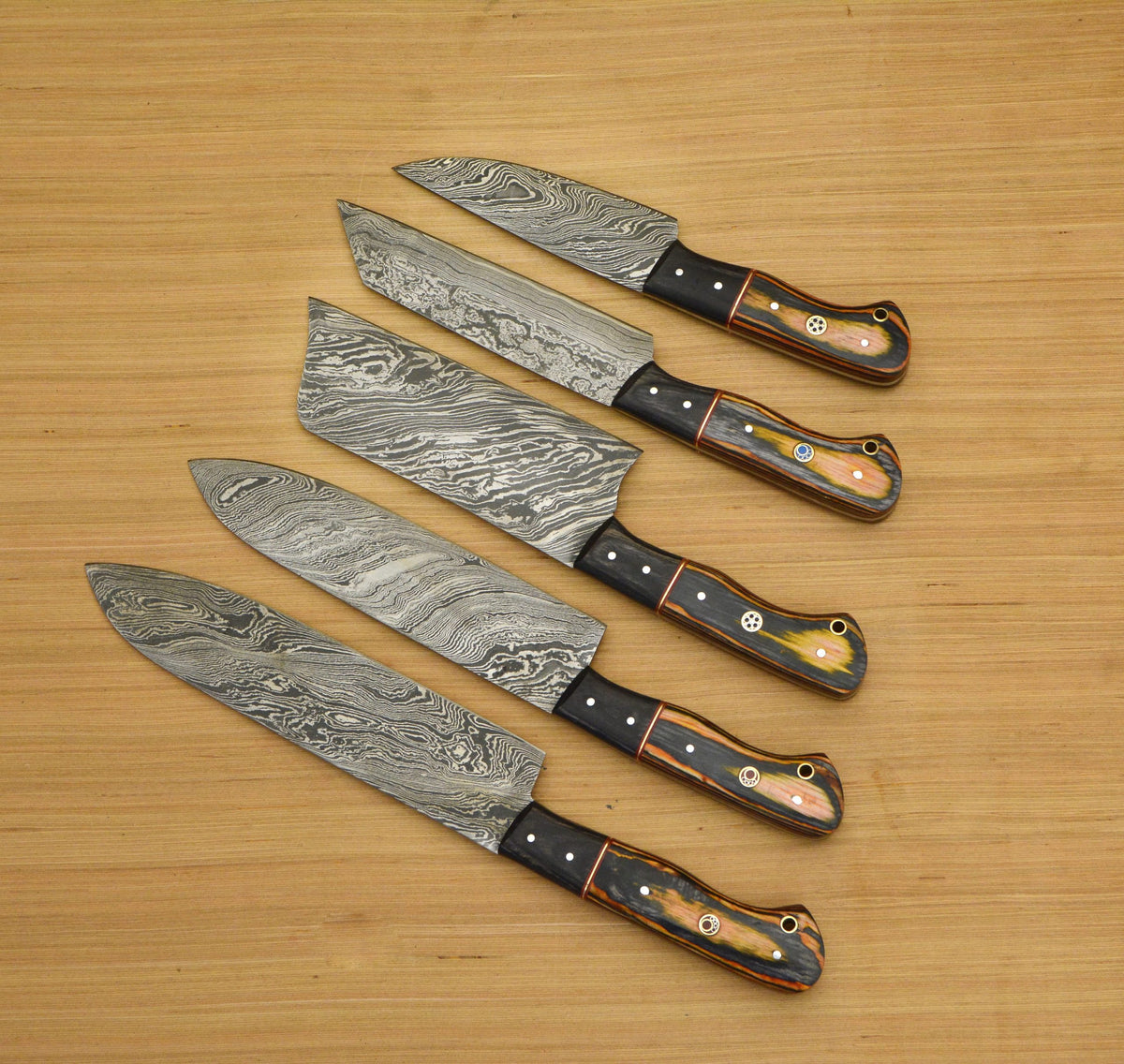 Damascus steel chef knife blades with orange bolster and mosaic pins