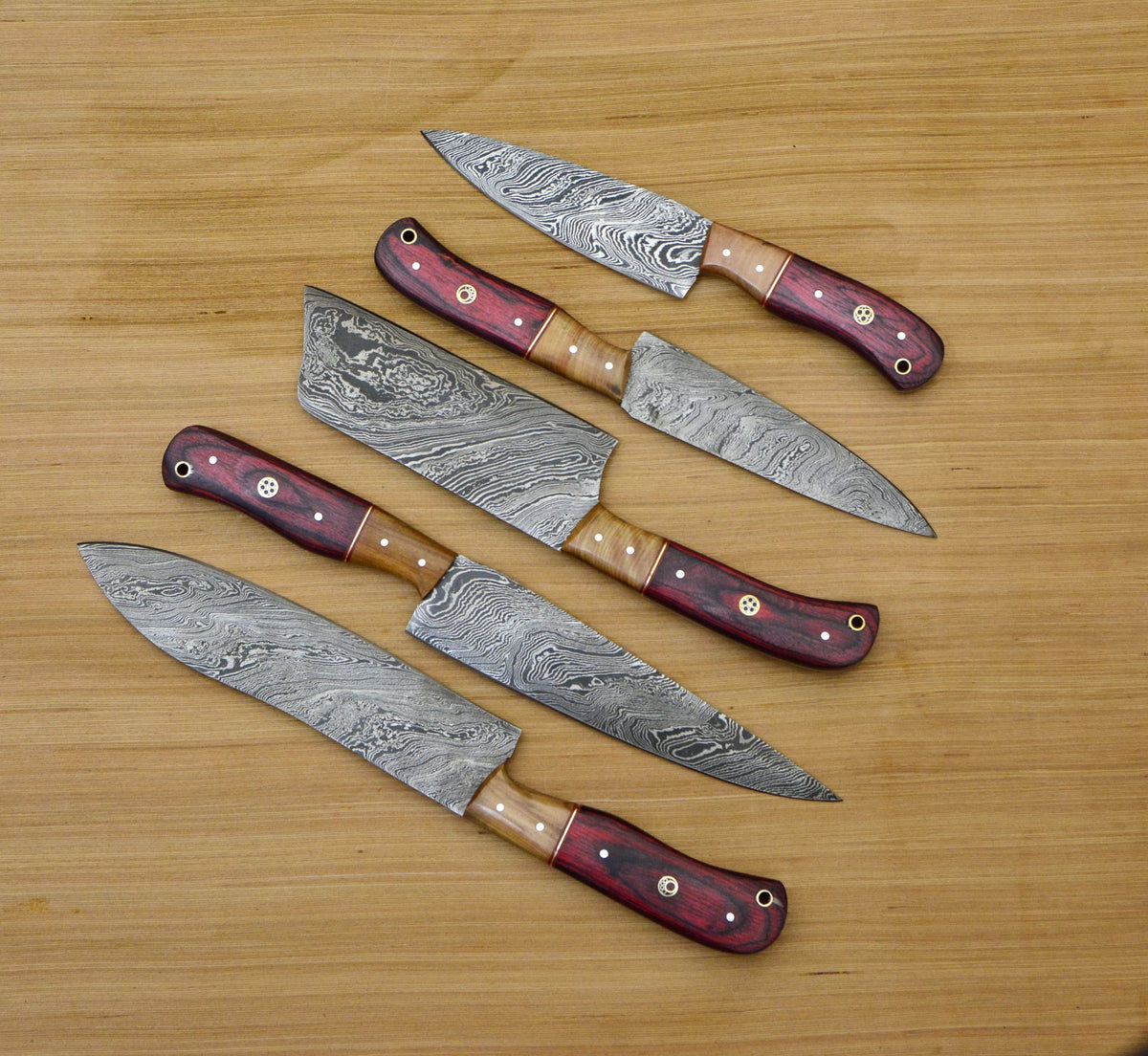 Damascus chef knife set fully sheathed in navy leather roll bag