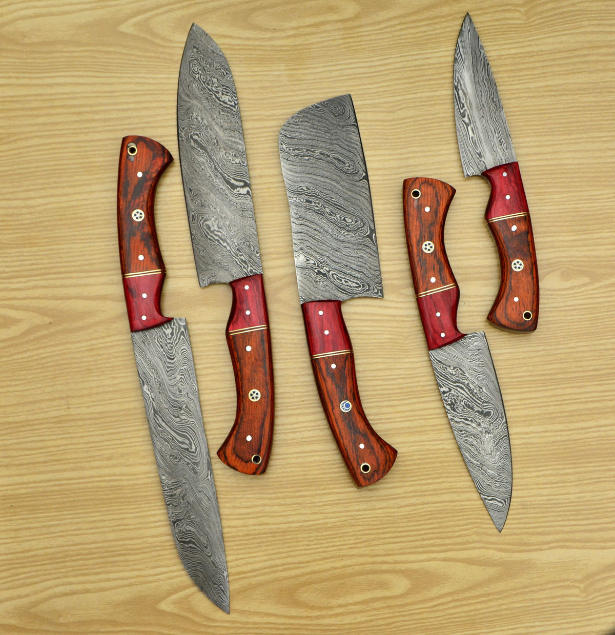 5 piece Damascus steel chef knife set fanned out showing pakka wood handles
