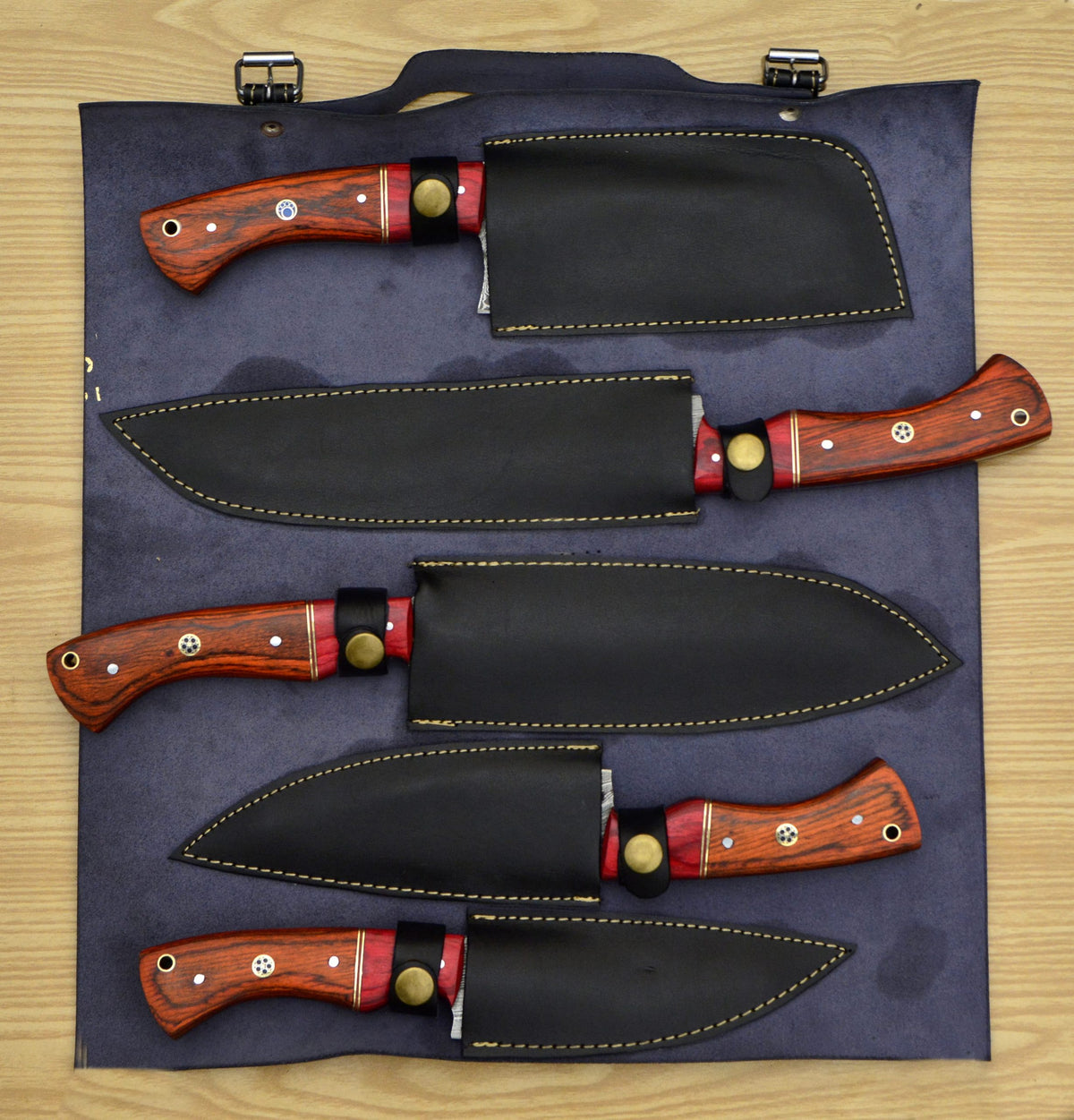 Damascus chef knife set with each blade in its own stitched leather sheath