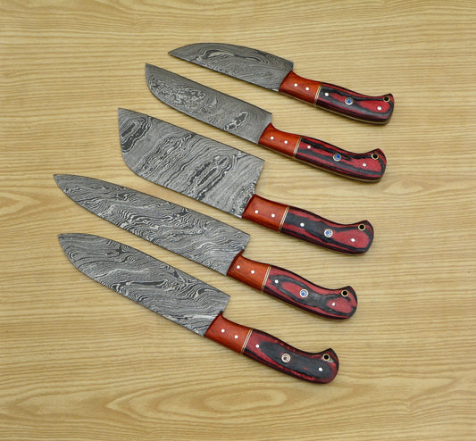 Damascus knife set of five fanned out showing red handles and blue mosaic pins