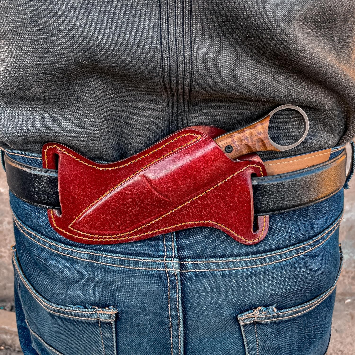 Best Bushcraft Knife carried in leather sheath on belt, worn at the back