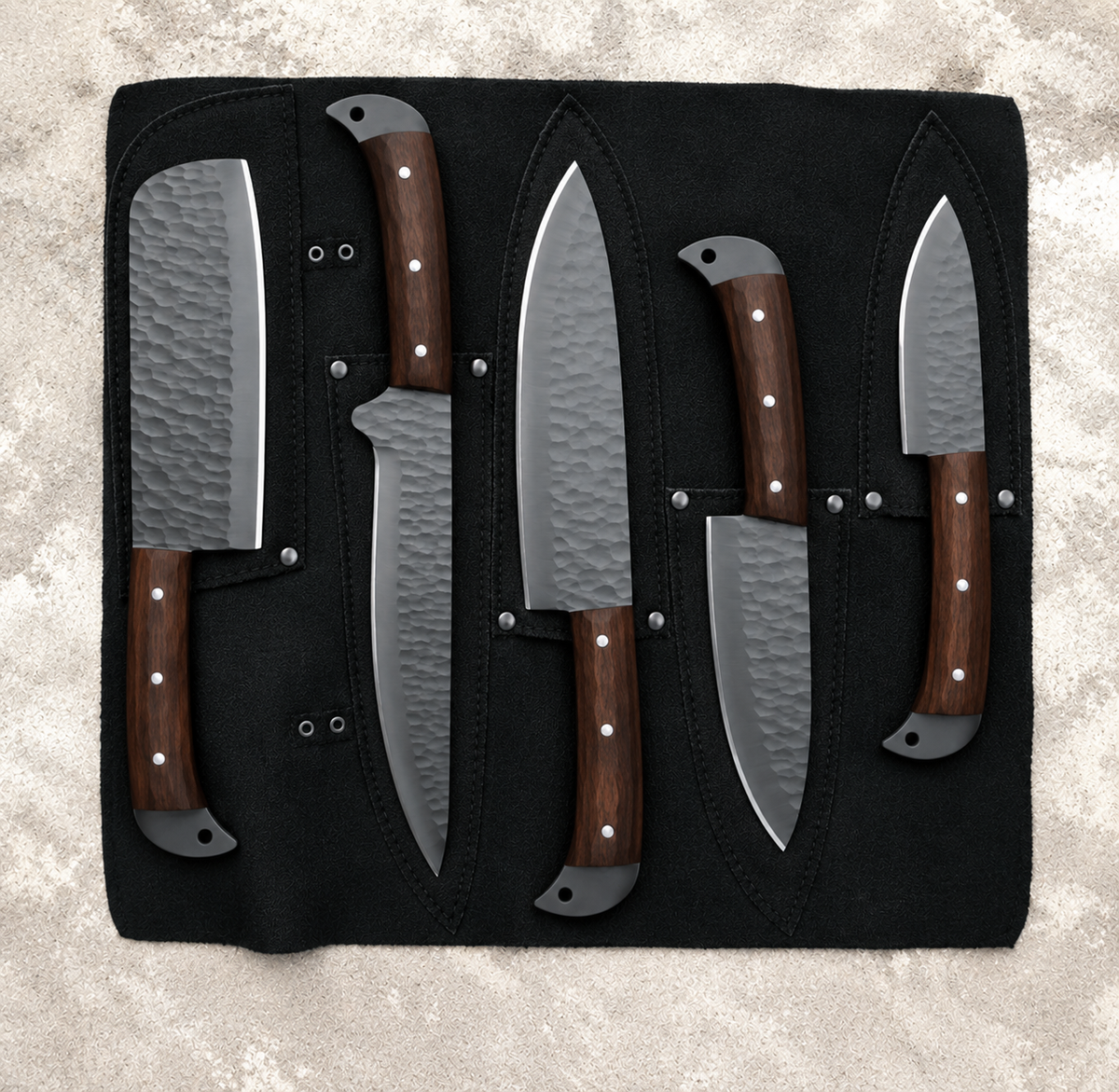 Black kitchen knife set of five with wood handles in a black leather roll