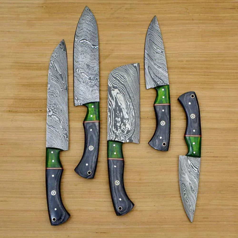 Overhead view of 5 piece Damascus steel chef knife set with green pakkawood handles on wood