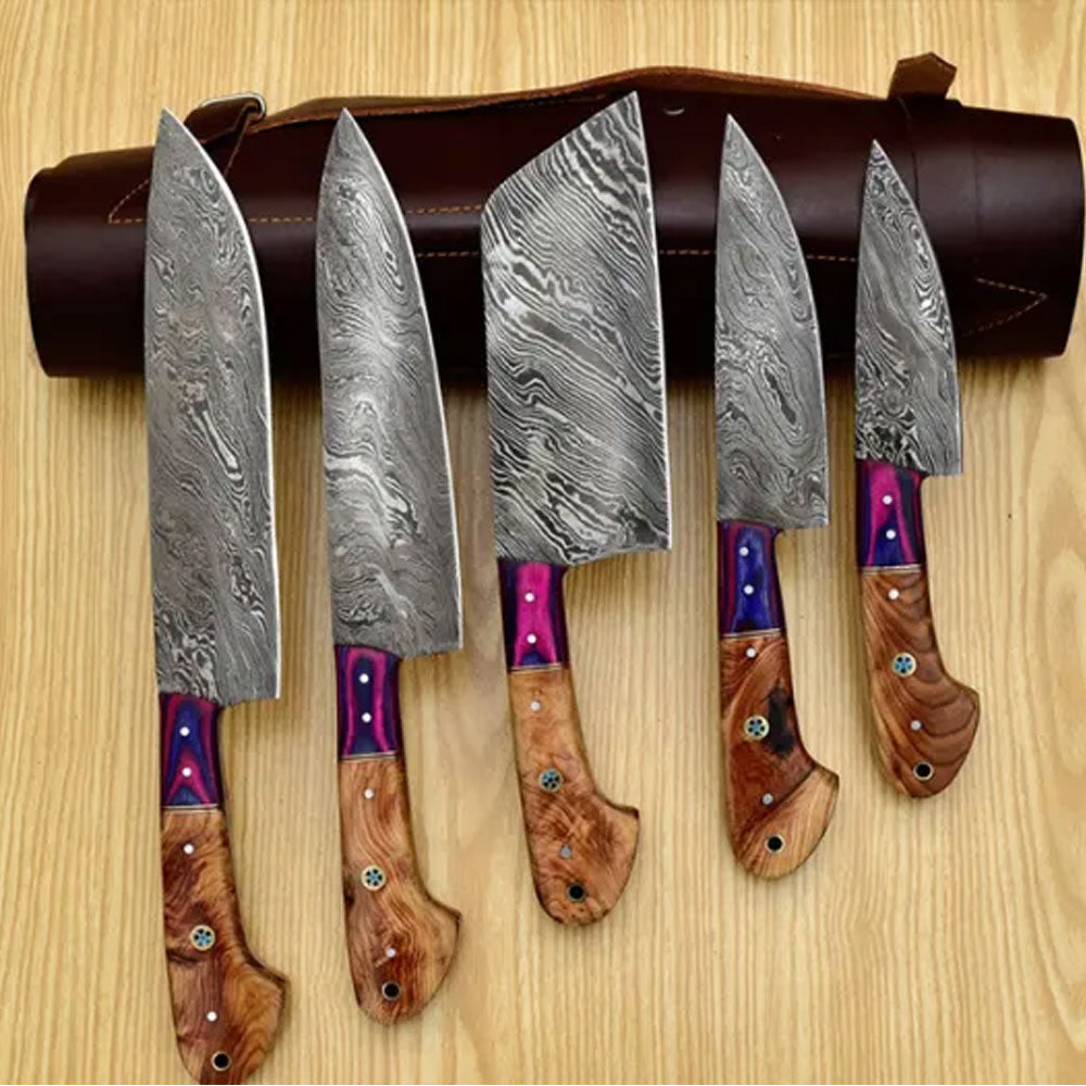 Sami Blades 5 piece Damascus knife set displayed before a rolled leather bag.