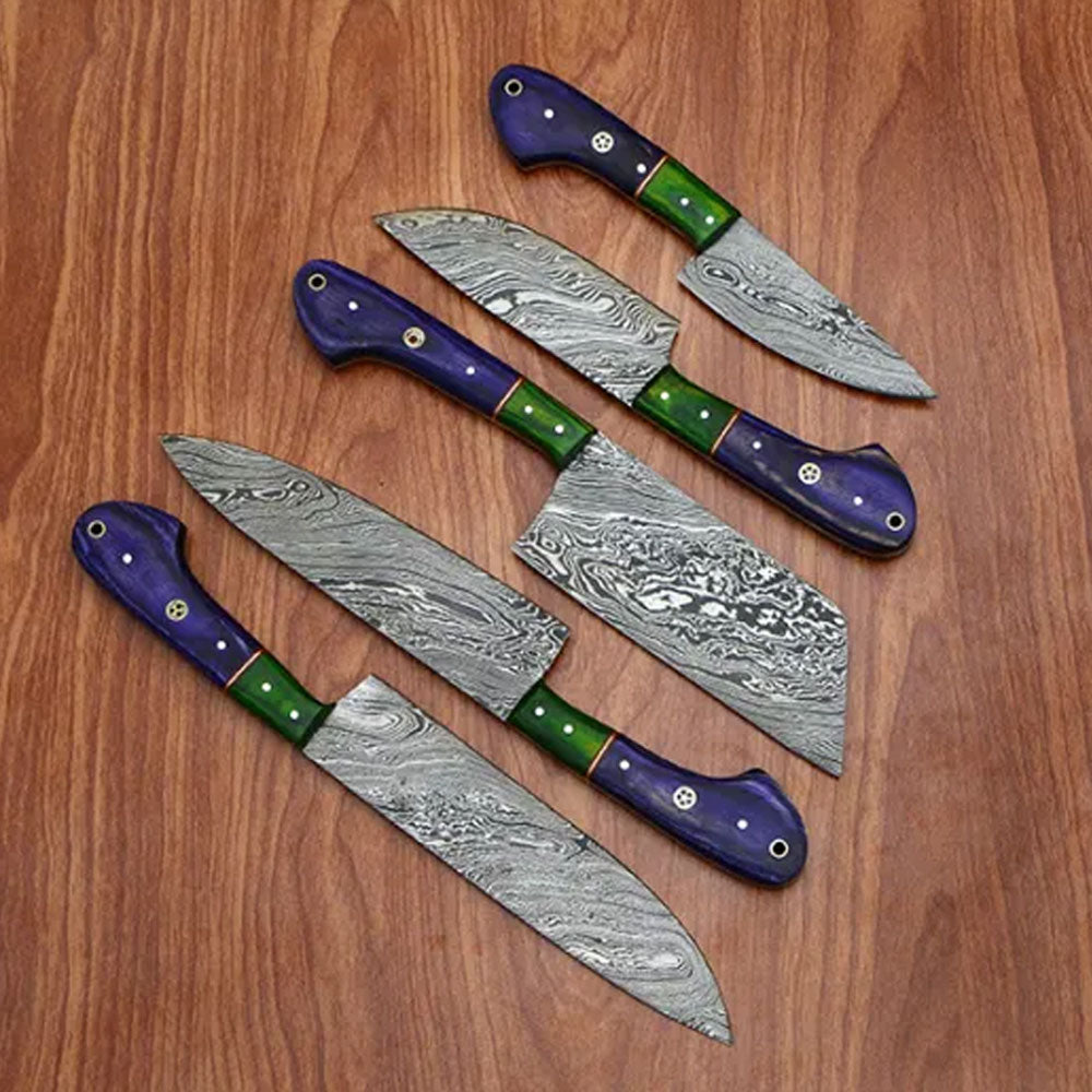 5 piece Sami Blades Damascus chef knife set featuring purple and green handles laid out on wood