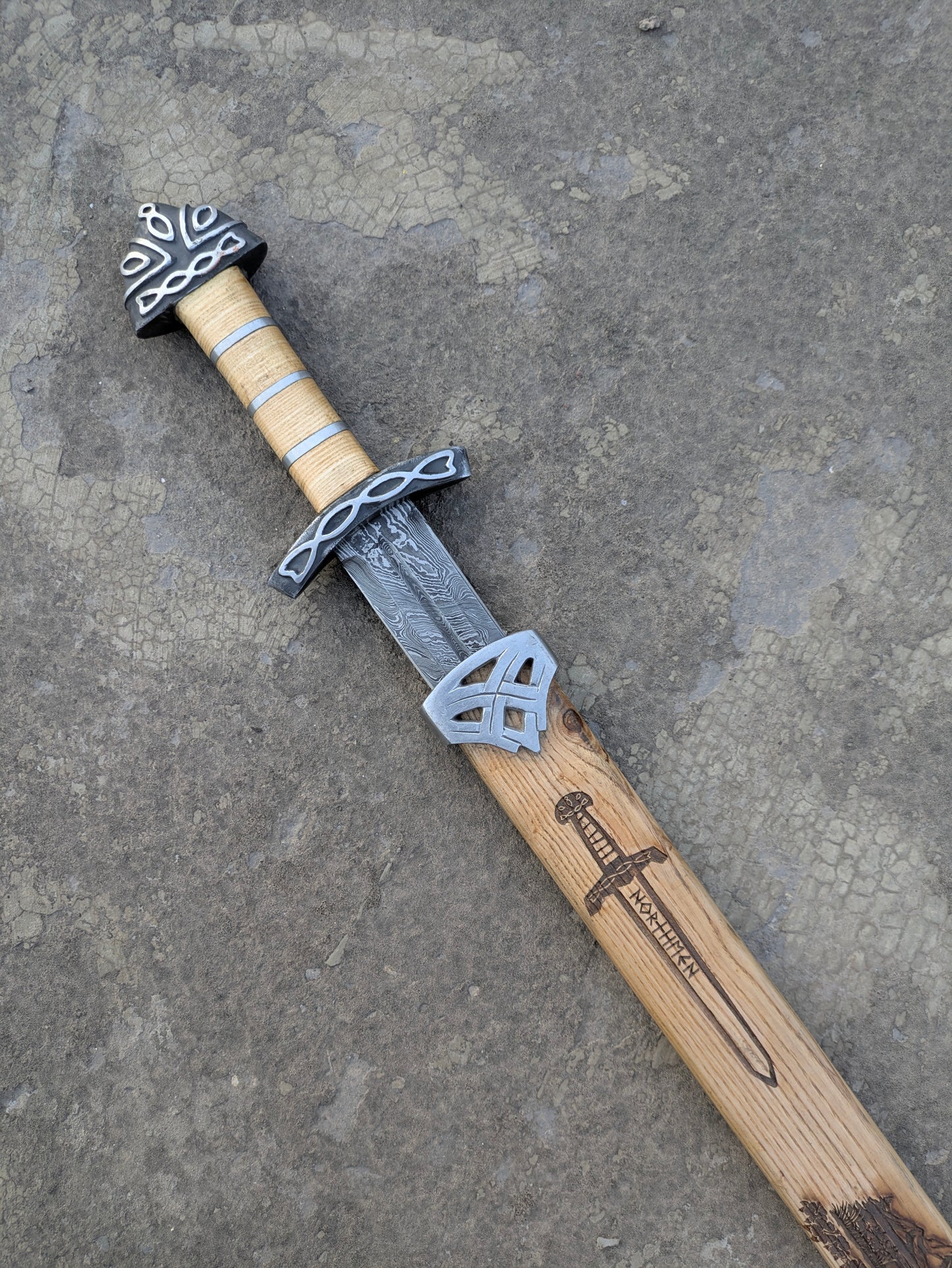 Damascus Steel Northman Viking Sword hilt with Celtic knot fittings and Northmen scabbard