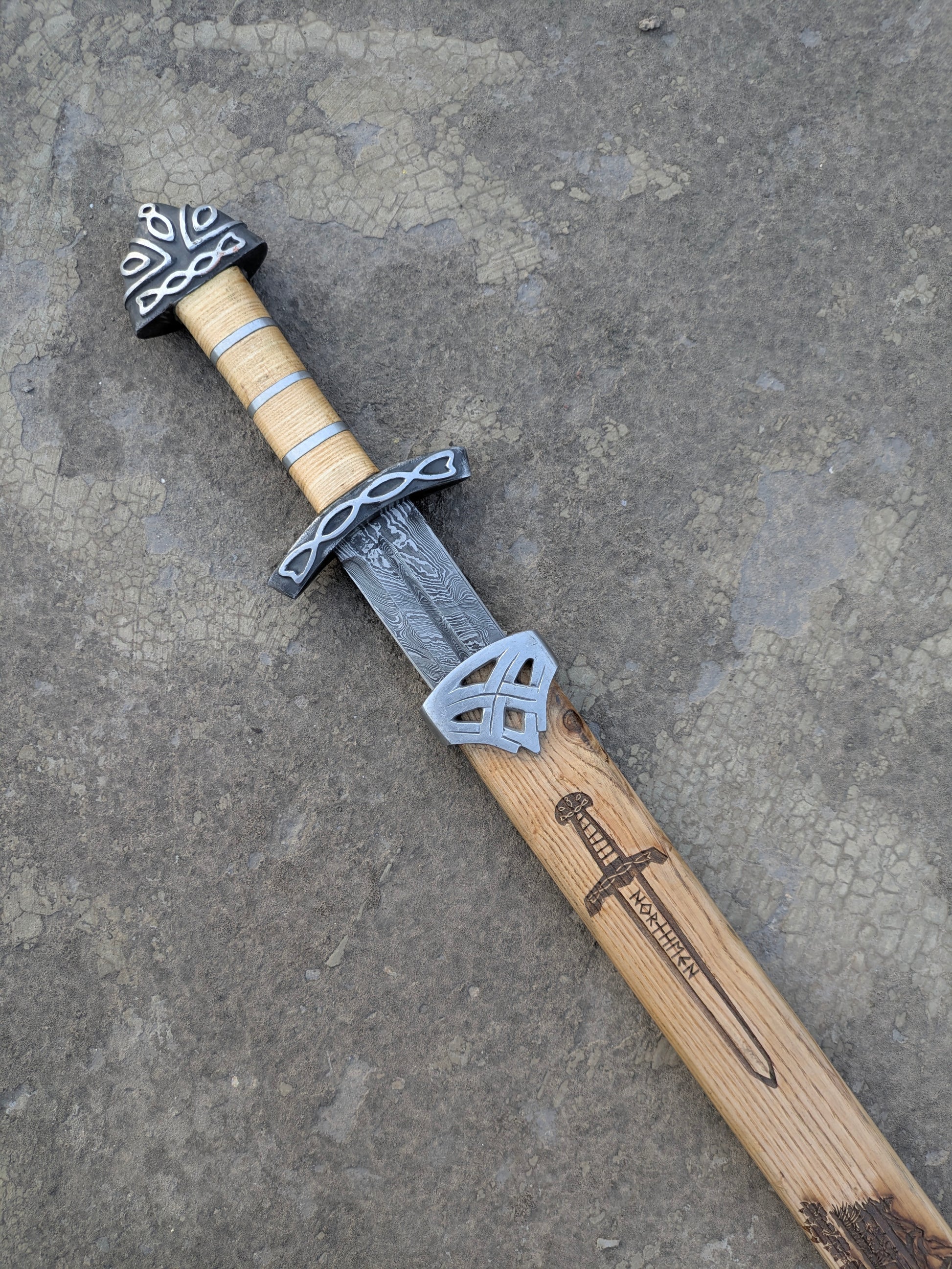 Damascus Steel Northman Viking Sword hilt with Celtic knot fittings and Northmen scabbard