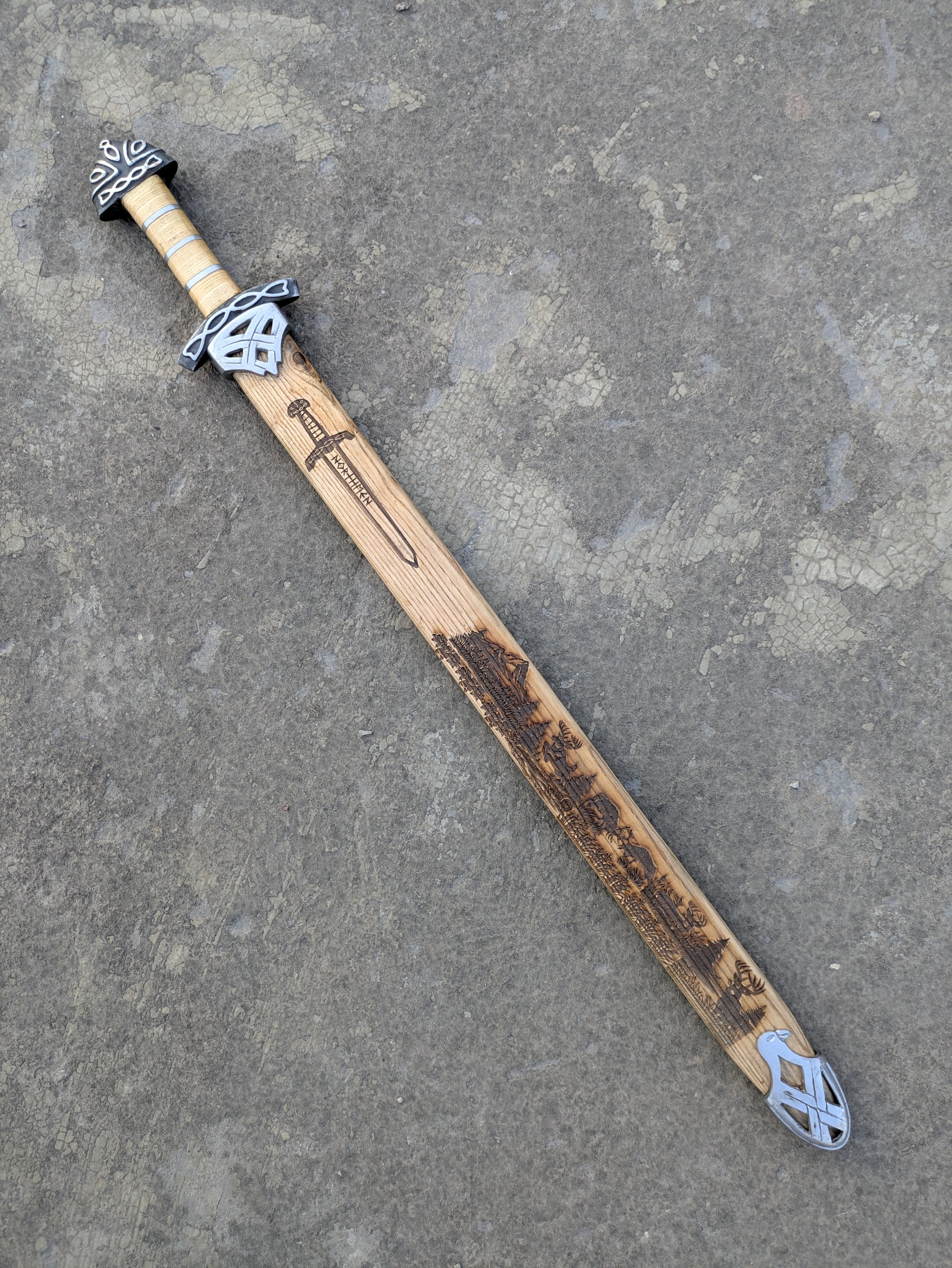 Damascus Steel Northman Viking Sword fully sheathed in engraved wooden scabbard