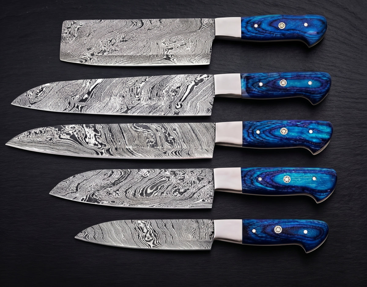 5 piece knife set with blue handles on black background